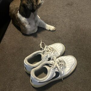 Nike White and Black Athletic Shoes with Lace-Up Design